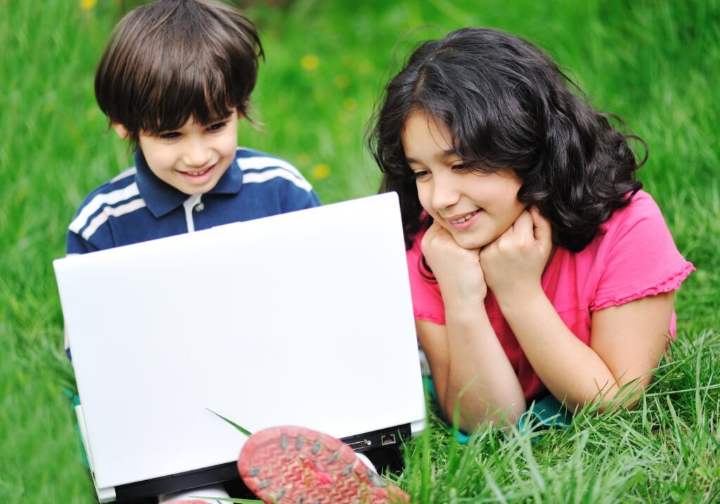 Children activity with laptop in nature using https //rare fiedtech.com