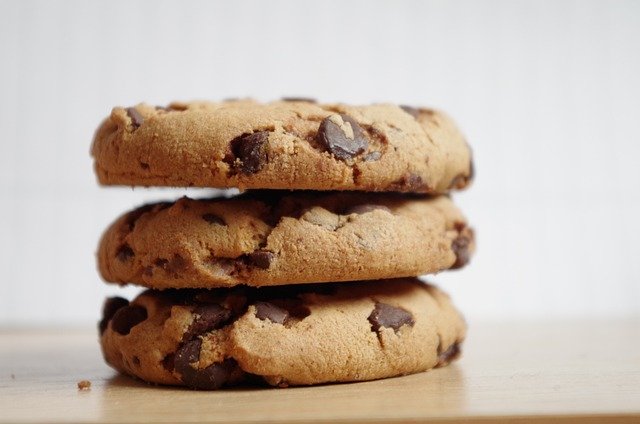 Stack of chocolate chip cookies like those from Crumbl Cookies near me.