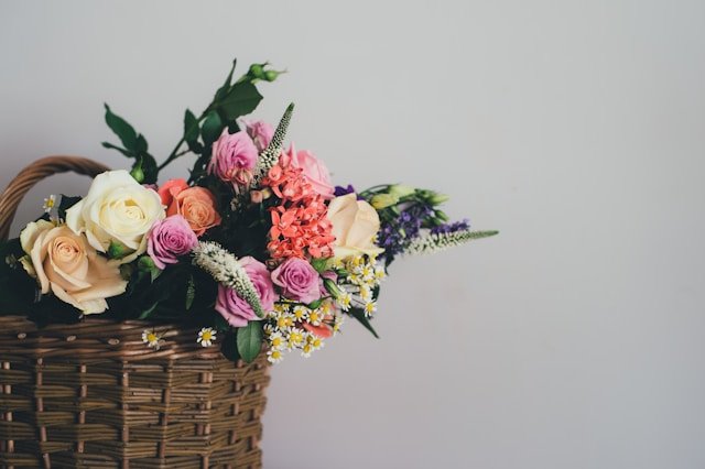 Colorful flowers in a basket, perfect for fall basket ideas.