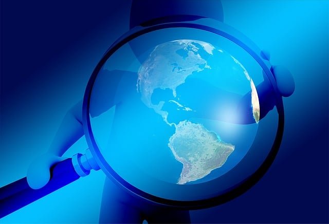 Magnifying glass over Earth representing SumoSearch.