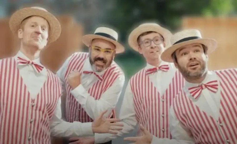 The Friendship Fire Company Barbershop Quartet performing on Everard PBS, dressed in classic red and white striped vests, bow ties, and straw hats